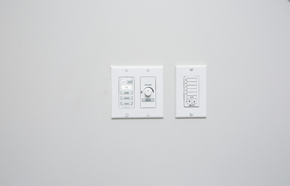 An Extron MediaLink controller mounted on wall